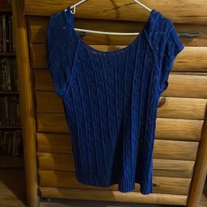 I’m selling this beautiful sweater top has a under shirt with it